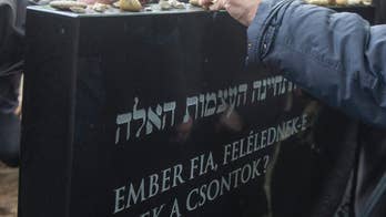 Hungary buries remains of Holocaust victims found in Danube