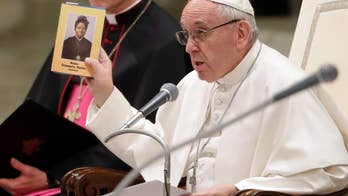 Pope repeats 'bridges not walls' after Trump travel ban