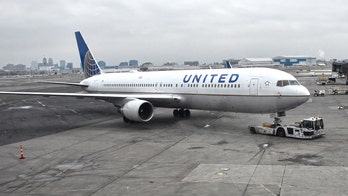 United employee's leg run over on tarmac by wheeled jet bridge