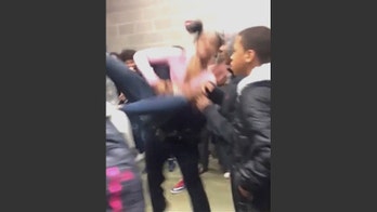 The Latest: Attorney: Girl slammed to floor has concussion