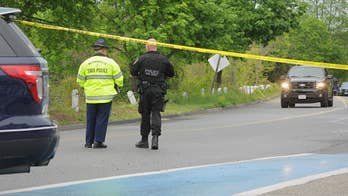 The Latest: Neighbors of police officer mourn his death