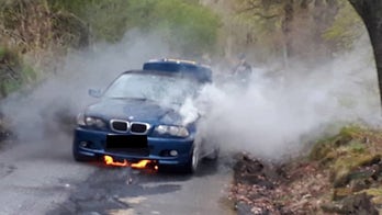 Elderly couple narrowly escape from burning car as they drive to anniversary dinner