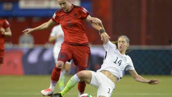 Morgan Brian of US, Germany's Alexandra Popp bang heads in 1st half of World Cup semifinal