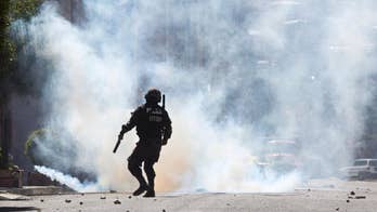 Bolivia police, workers clash at protest over plant shutdown