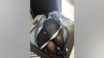 Border guards in Spain find migrants hidden in suitcase, car