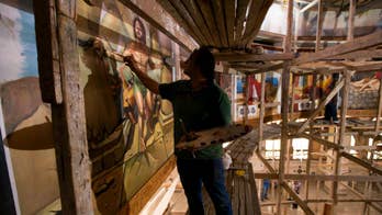 Egyptian artist paints church murals, unfazed by attacks