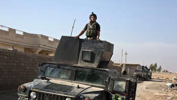 Iraqi forces begin assault on Mosul district with artillery
