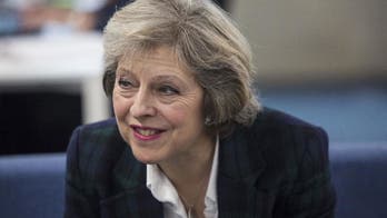 May says UK will champion free trade in changing world