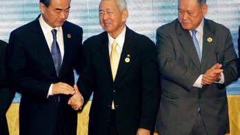 Stepping in for weak ASEAN, Japan, Australia, US chide China