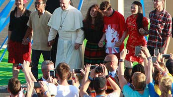 The Latest: Italian journalist dies covering papal visit