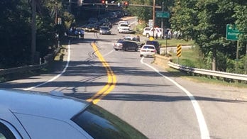 Baltimore bank robbery suspect dead, another hurt in shooting, police say