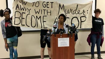 The Latest: 4 arrested as protests remain calm in Charlotte