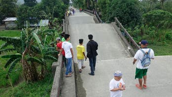 Nighttime Philippines quake kills at least 6, damages runway