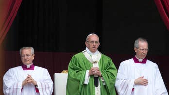 Pope invites refugees to join him on stage for audience