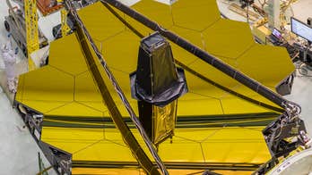 NASA reveals gold-coated space mirror
