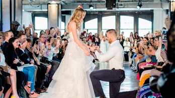 Model gets engaged on the runway during Bridal Week fashion show
