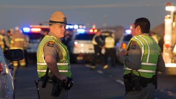 Passing driver kills man who shot Arizona officer in ambush