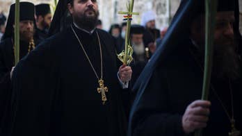 Worshippers throng to Jerusalem for Palm Sunday