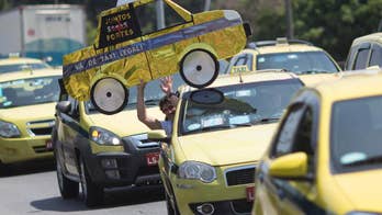 Uber looks to dominate in Brazil while taxis push to ban app
