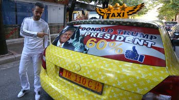 Albanian taxi driver decorates his cab with Trump pictures