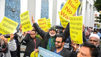 The Latest: US judge temporarily blocks Trump's travel ban
