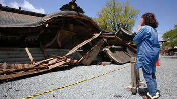 Japanese seek 'holy water' at quake-damaged Shinto shrine