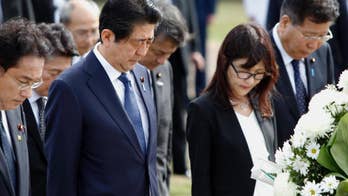 Japanese Prime Minister Abe lays wreaths at Hawaii cemeteries
