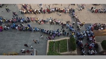 India's currency swap sets off endless lines of frustration