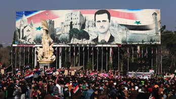 Syrian activists say IS has killed 12 captives in Palmyra