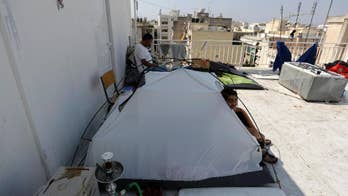 The Latest: Pope takes charge of church's migrant response