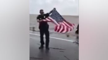 Hurricane Irma: Videos show police officers rescuing American flag