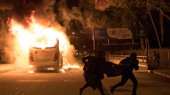 Protesters torch buses, block roads during Brazil strike