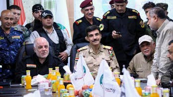 Iraqi forces battle IS militants outside Fallujah