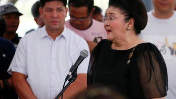 Marcos family hold vigil at dictator's tomb amid protests