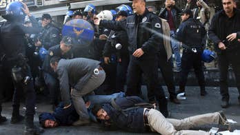 The Latest: Turkish police clash with Kurdish supporters