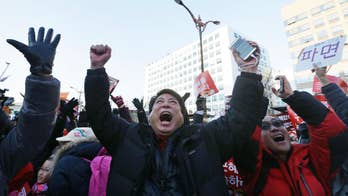 The Latest: SKorean lawmakers begin vote to impeach leader