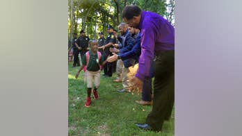 Black professionals cheer on city students starting school