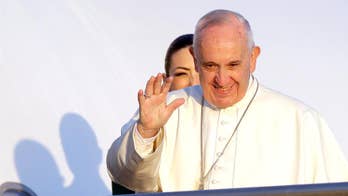 The Latest: Lesbos: Migrant boat stopped ahead of pope visit