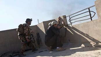 Iraqi units clear Mosul buildings after advances, IS attacks