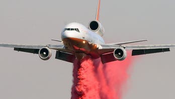 Crews make progress against Western fires, brace for winds