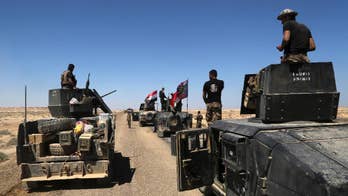 Trapped civilians slow Iraqi army's battle against IS in Hit