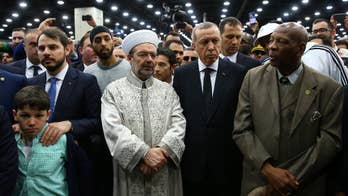 Turkey's Erdogan, in US for Ali's funeral, cuts trip short