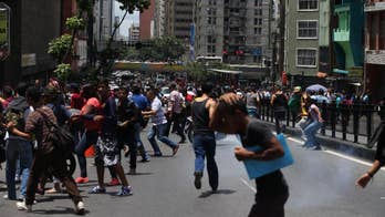 Venezuela police repel rare protest near presidential palace