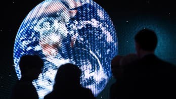The Latest: In Davos, refugees make case for global mobility