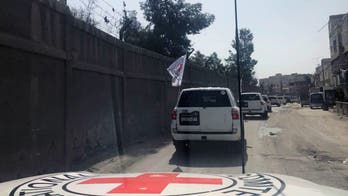 Aid convoy in Syria enters besieged rebel-held Damascus suburbs
