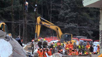 Eastern China housing collapse leaves 9 buried