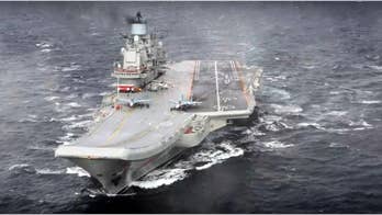 Russia says it starts Syrian drawdown with aircraft carrier