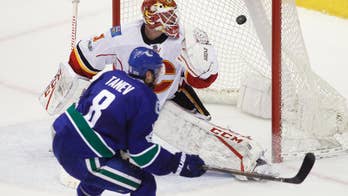 Tanev scores in overtime, Canucks edge Flames 2-1