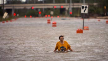 Homeless Ga. woman wades in neck-high floodwater to safety