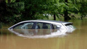 The Latest: Workers body near bridge after heavy rains